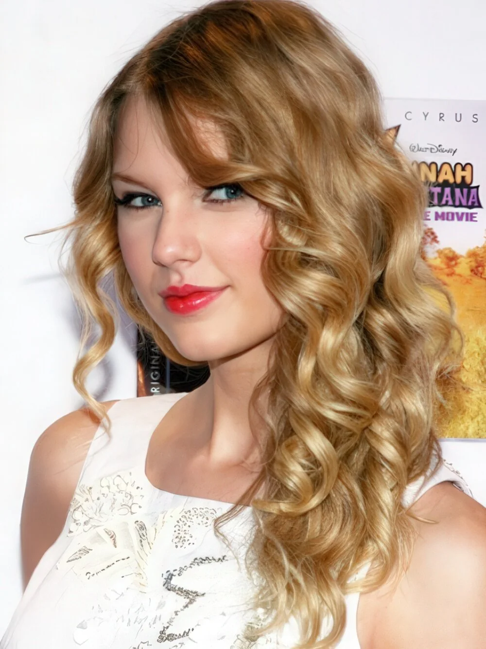 Long blonde curls with side-swept bangs.