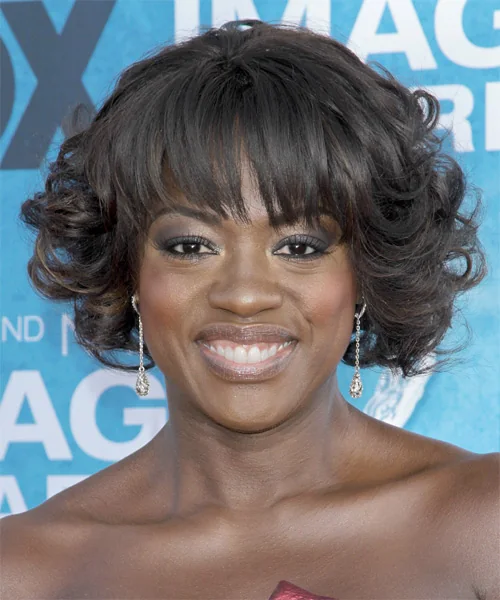 Photo showing soft Curly Bob With Wispy Bangs, with the hairstyle clearly visible.