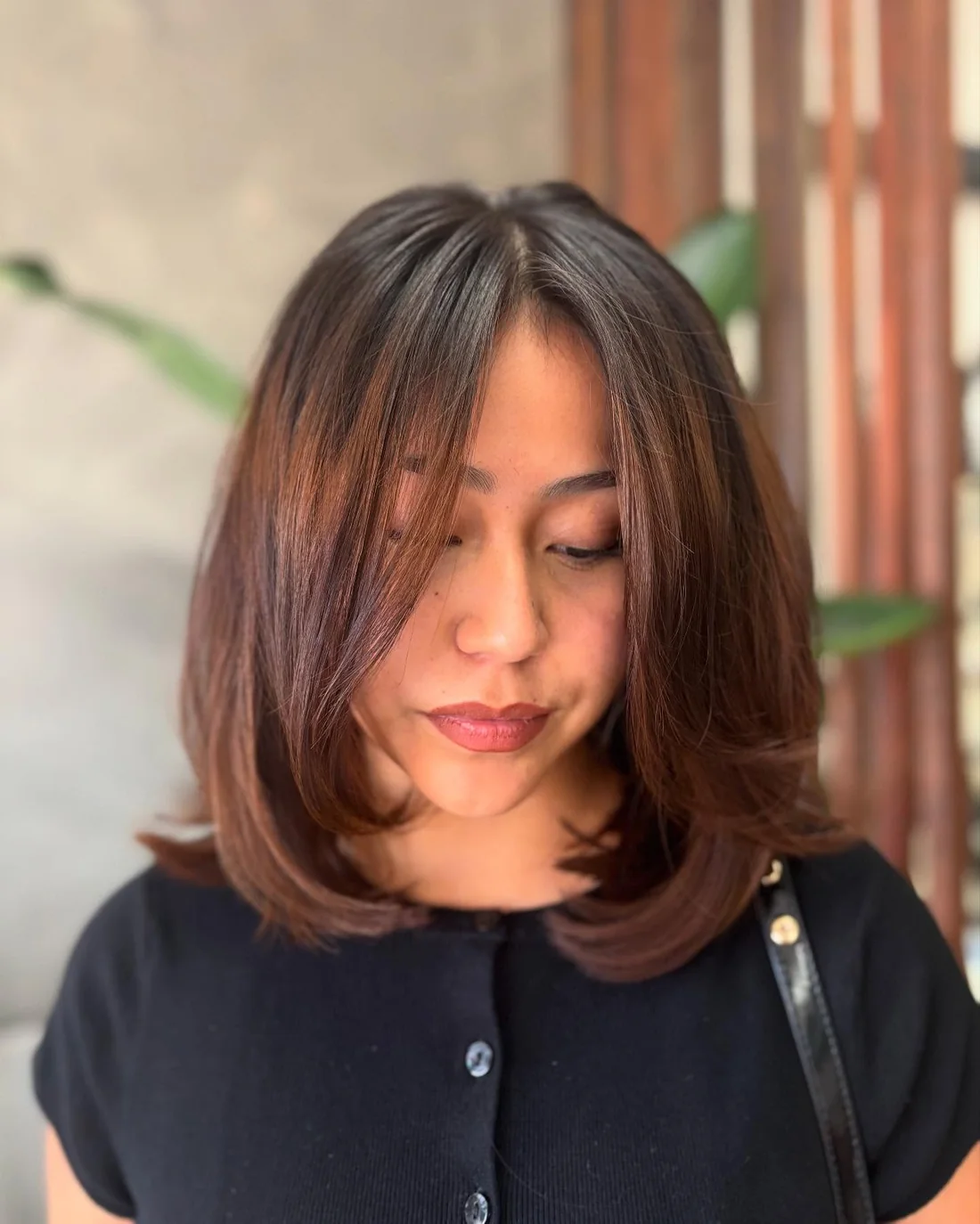 Rounded Brunette Lob With Curtain Bangs.