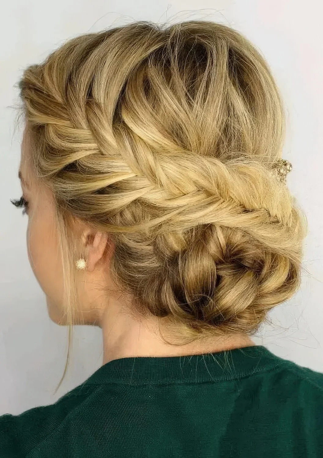 Fishtail side braided updo with a braided bun and some locks down.