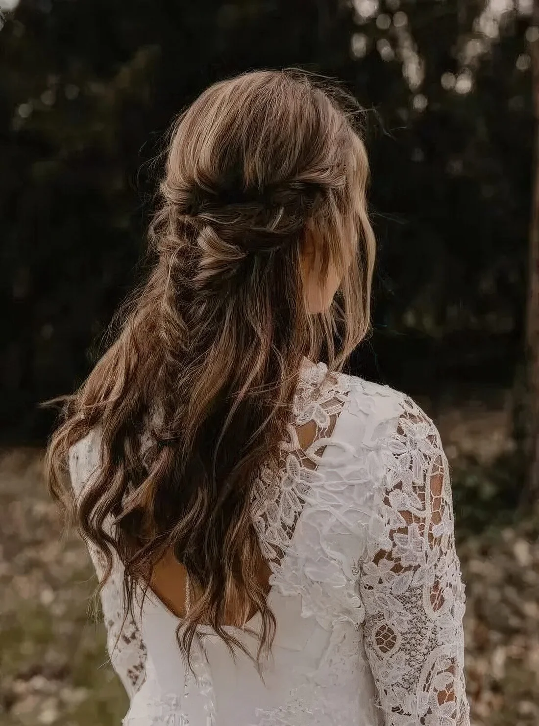 Boho half updo with a double braided halo and a fishtail braid and waves down.