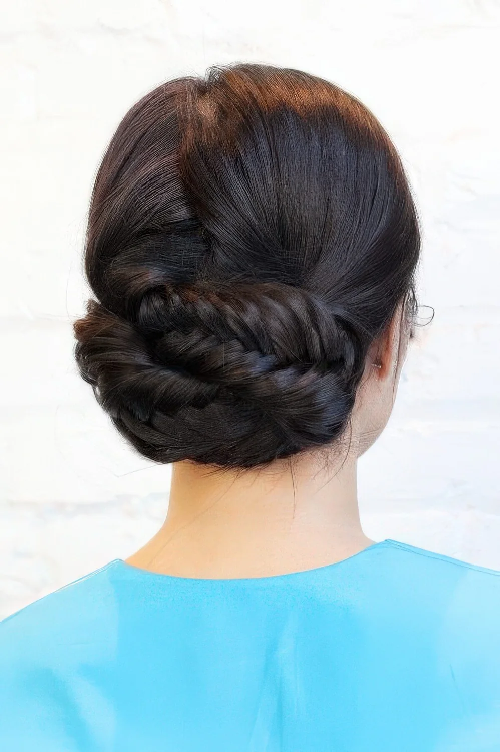 Fishtail braid low updo with a volumetric top.