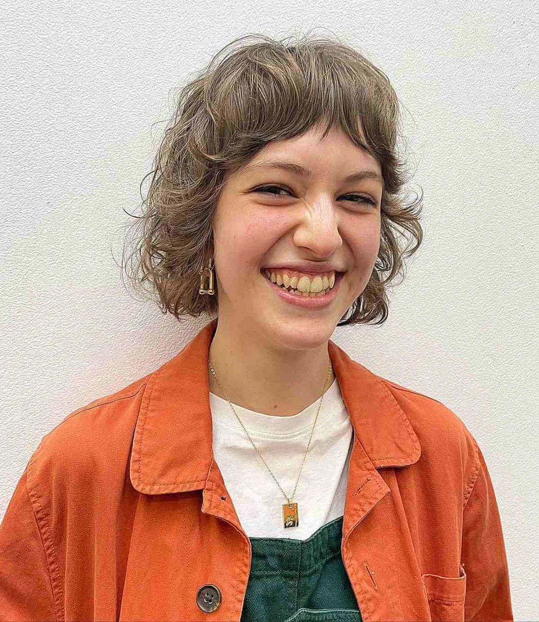 Wavy Shag With Short Textured Bangs.