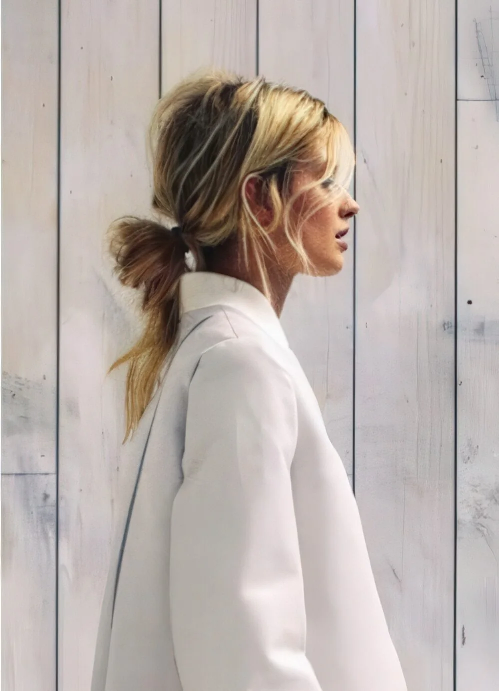 Photo showing loose blonde low ponytail, with the hairstyle clearly visible.