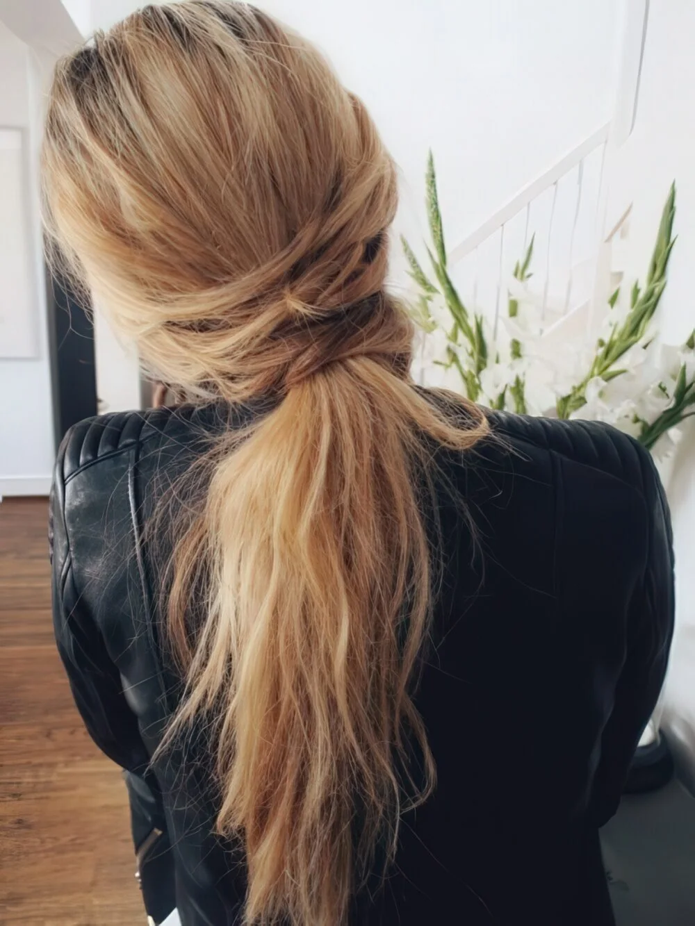 Twisted low ponytail with a relaxed crown.