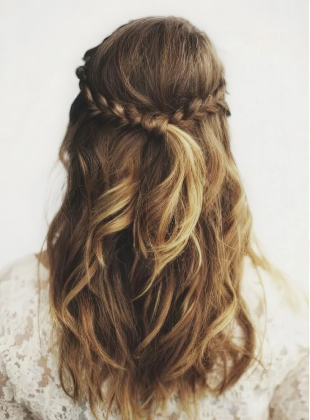Photo showing half-up twist on long wavy hair, with the hairstyle clearly visible.