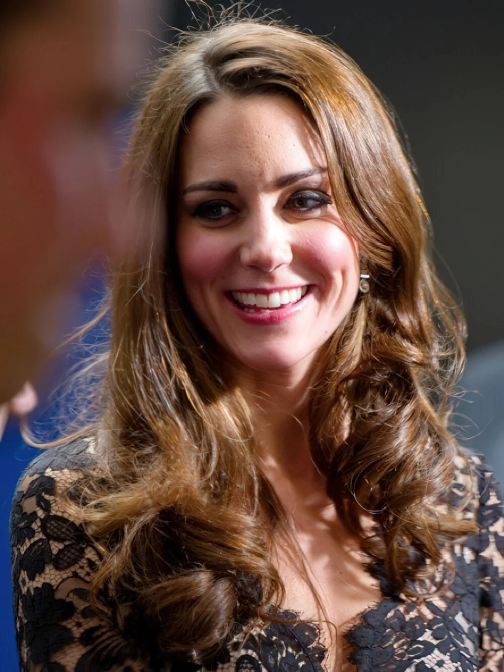 Long brunette layers with polished curls.