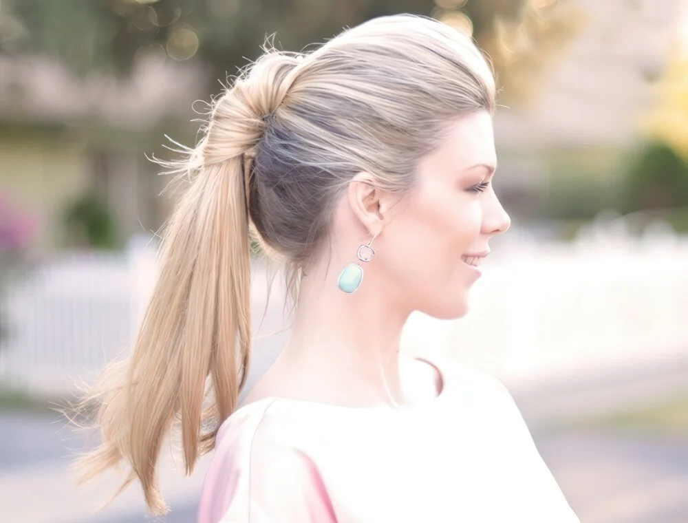 Twisted blonde ponytail with a smooth crown.