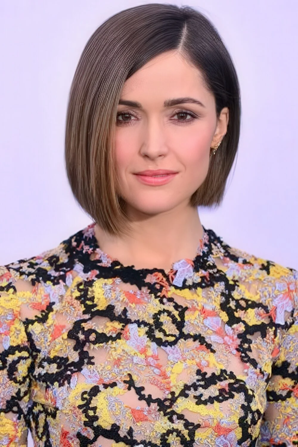 Sleek blunt brunette chin-length bob.
