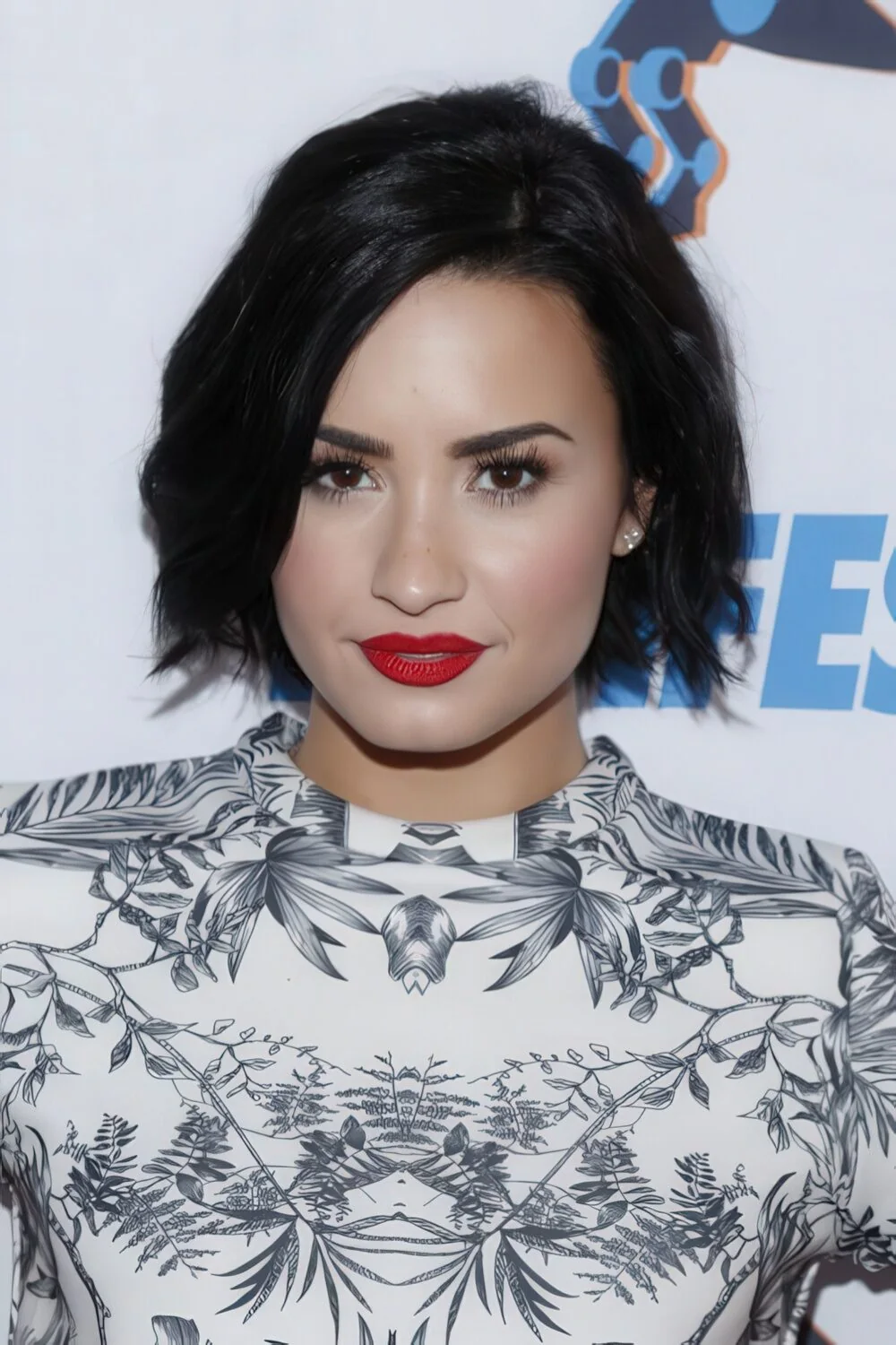 Tousled black chin-length bob with a side part.