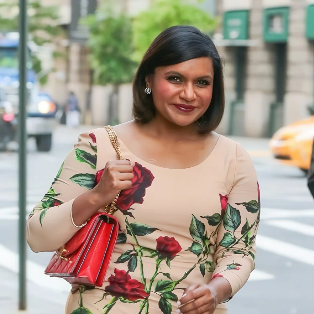 Sleek black chin-length bob with a side part.