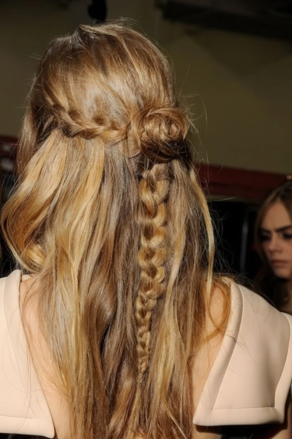Half-up blonde style with a slim accent braid.