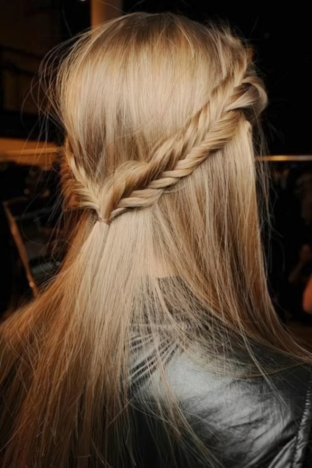 Waterfall braid across long blonde hair.