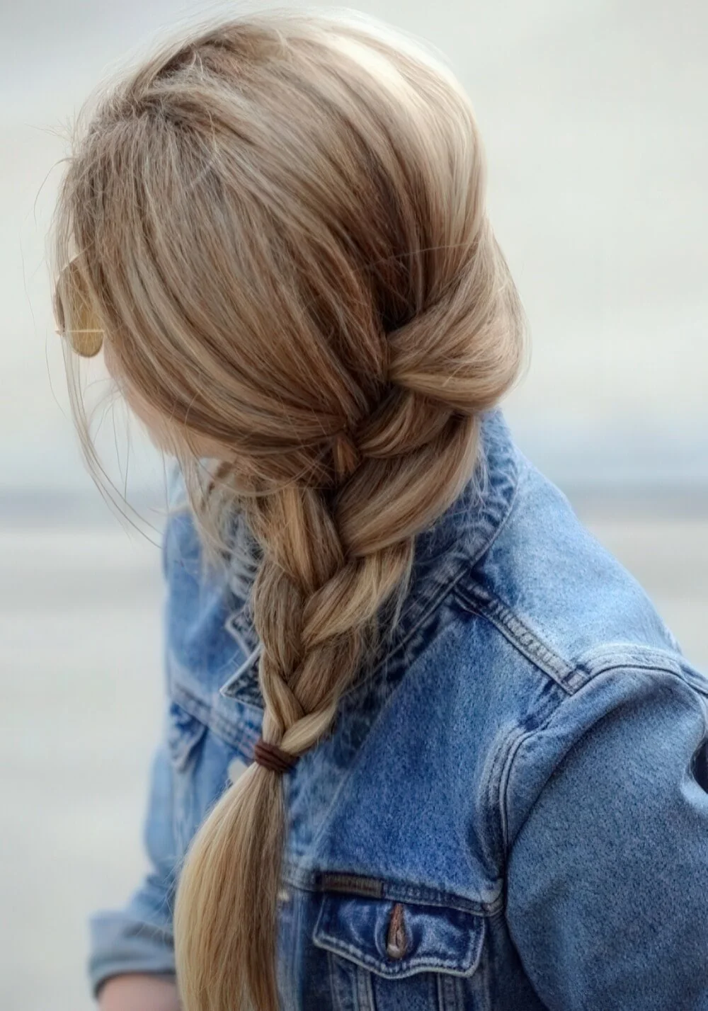 Loose blonde side braid viewed from the back.