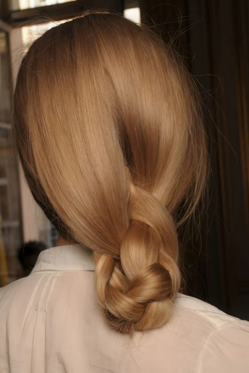 Photo showing loose brunette looped ponytail, with the hairstyle clearly visible.