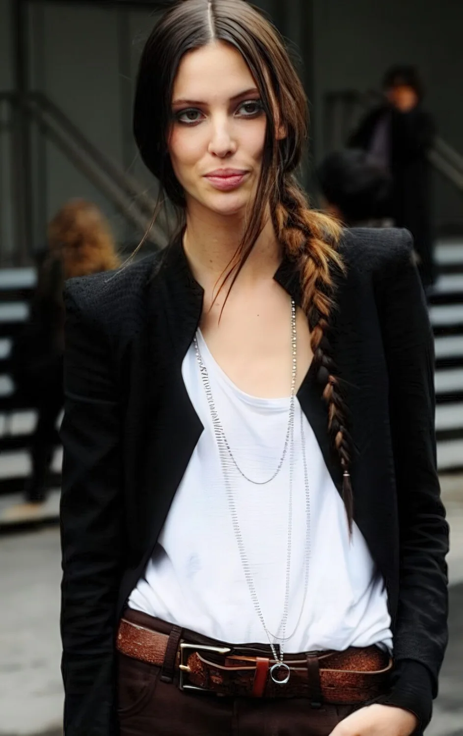 Photo showing slim dark fishtail side braid, with the hairstyle clearly visible.