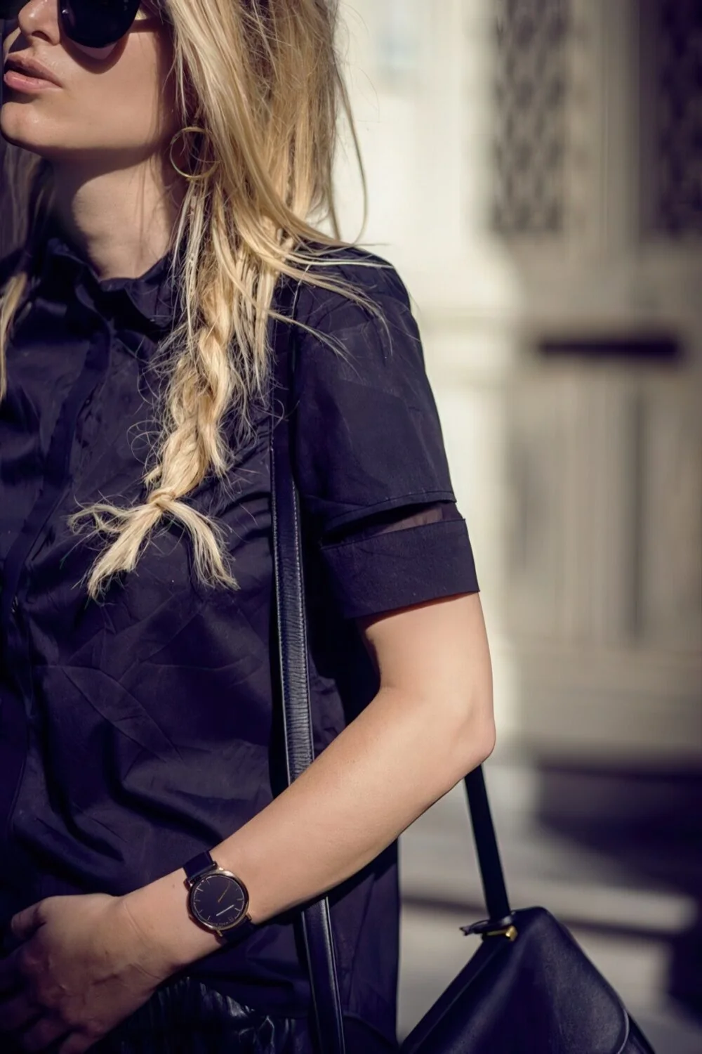 Relaxed blonde side braid over the shoulder.