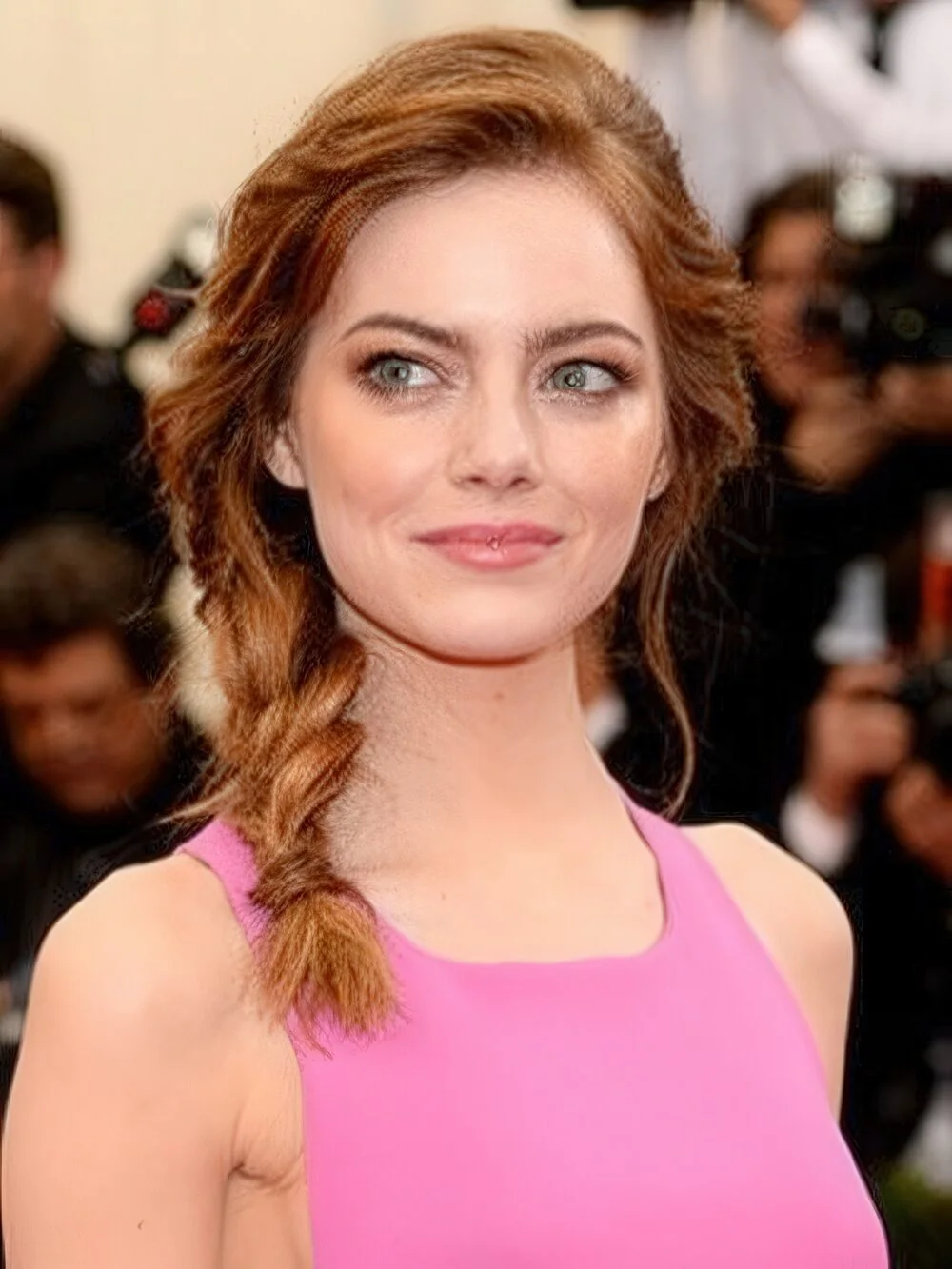 Photo showing loose copper fishtail side braid, with the hairstyle clearly visible.