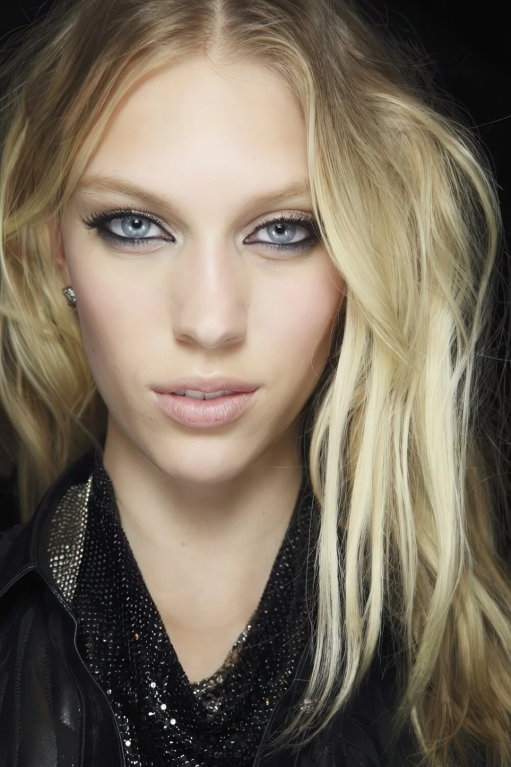 Tousled blonde layers with a center part.