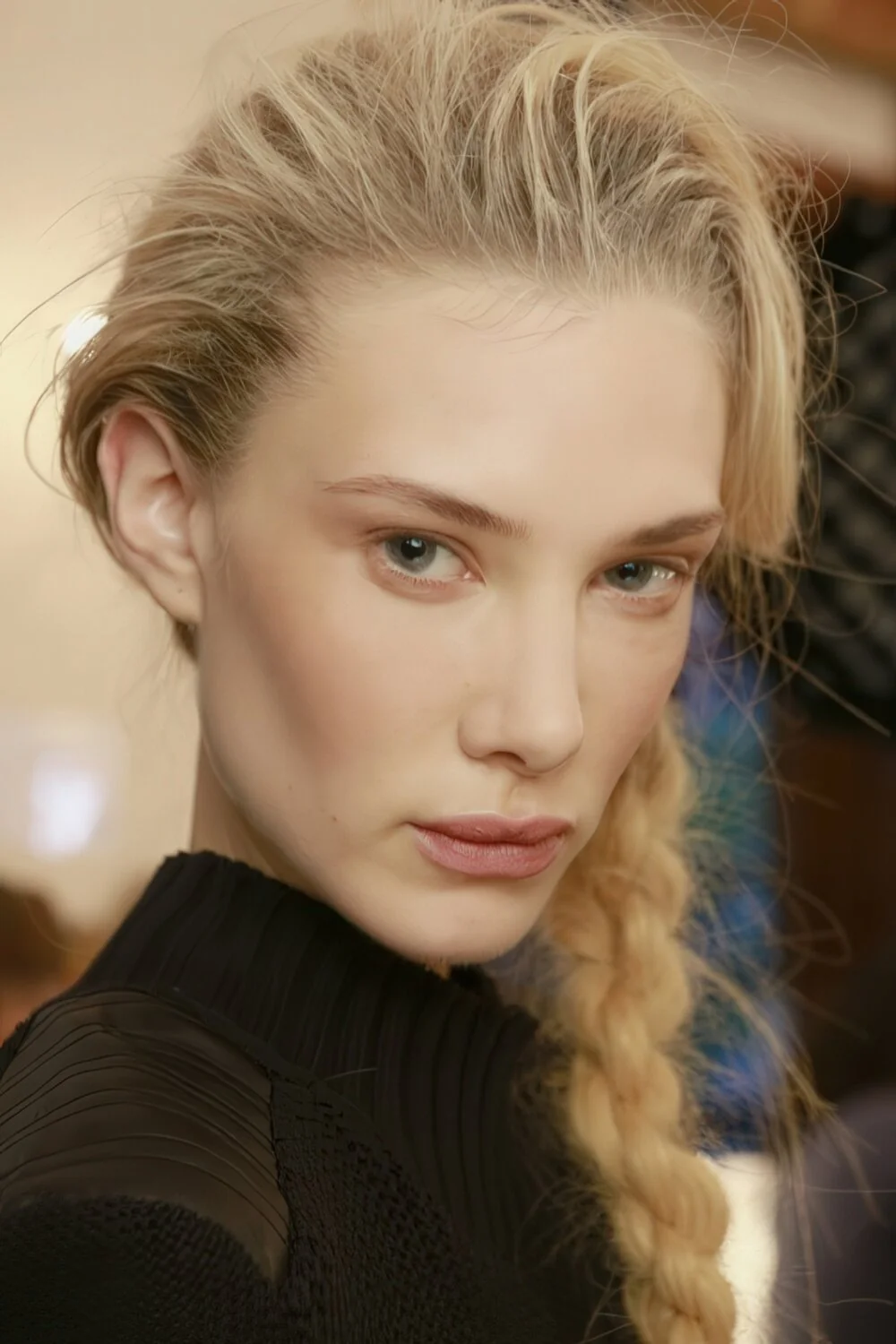 Photo showing thick blonde side braid, with the hairstyle clearly visible.