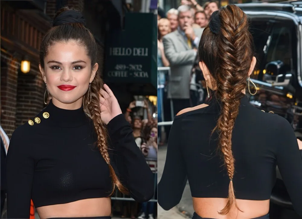 Photo showing long brunette fishtail ponytail, with the hairstyle clearly visible.