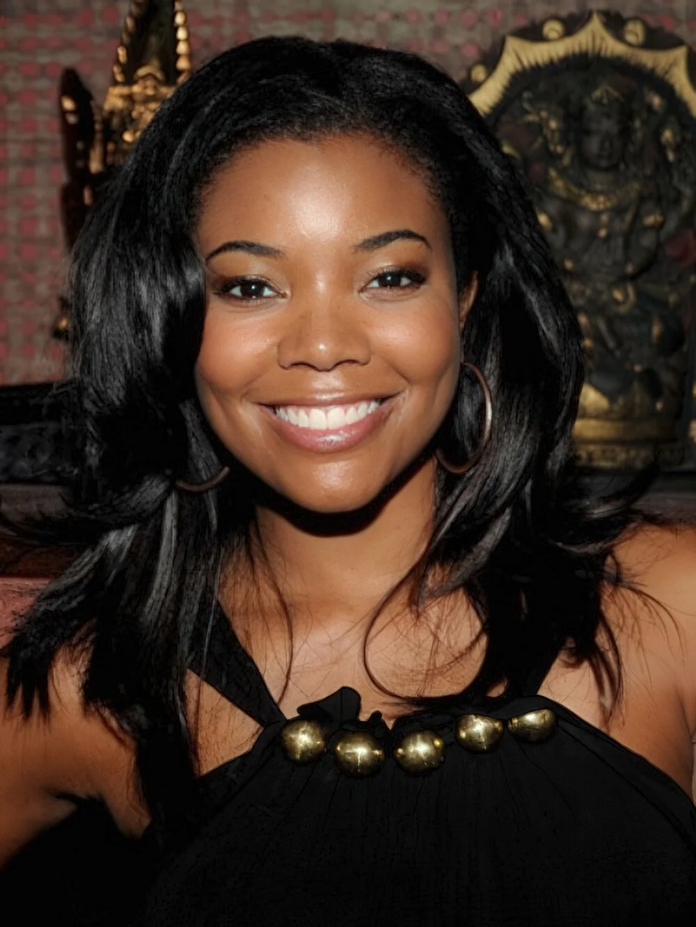 Long natural black waves with a center part.
