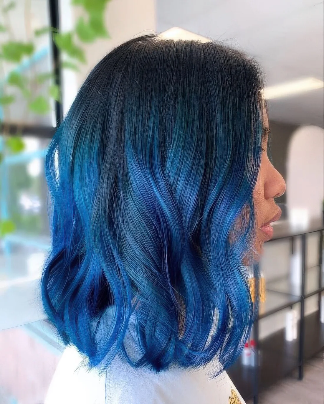 Black long bob with electric blue lcoks and waves.