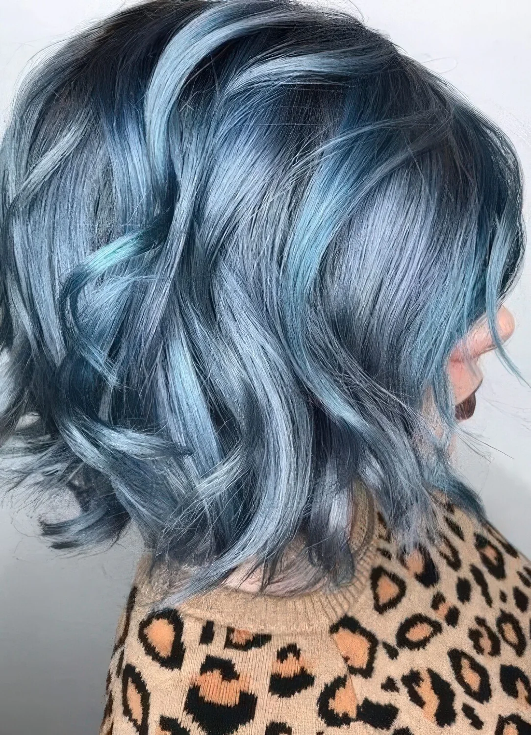 Wavy bob in various metallic shades of blue.