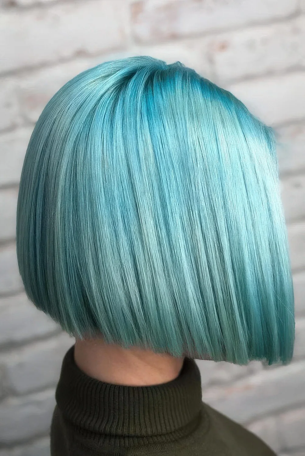 Turquoise angled bob with center part.