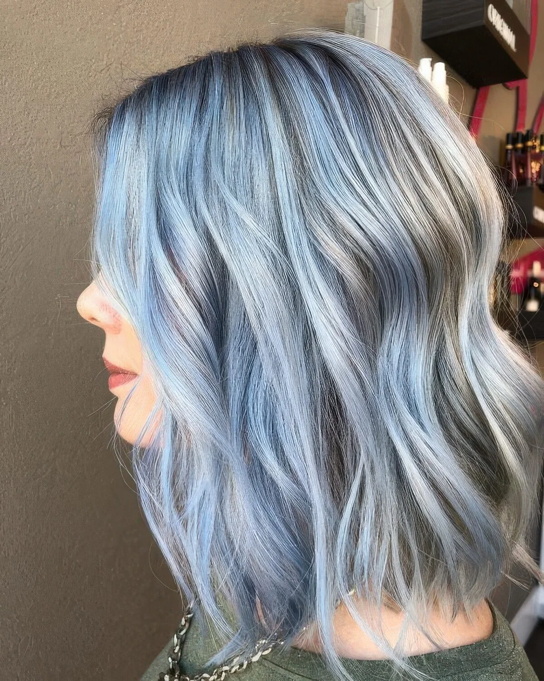 Grey wavy long bob with light ocean blue balayage.