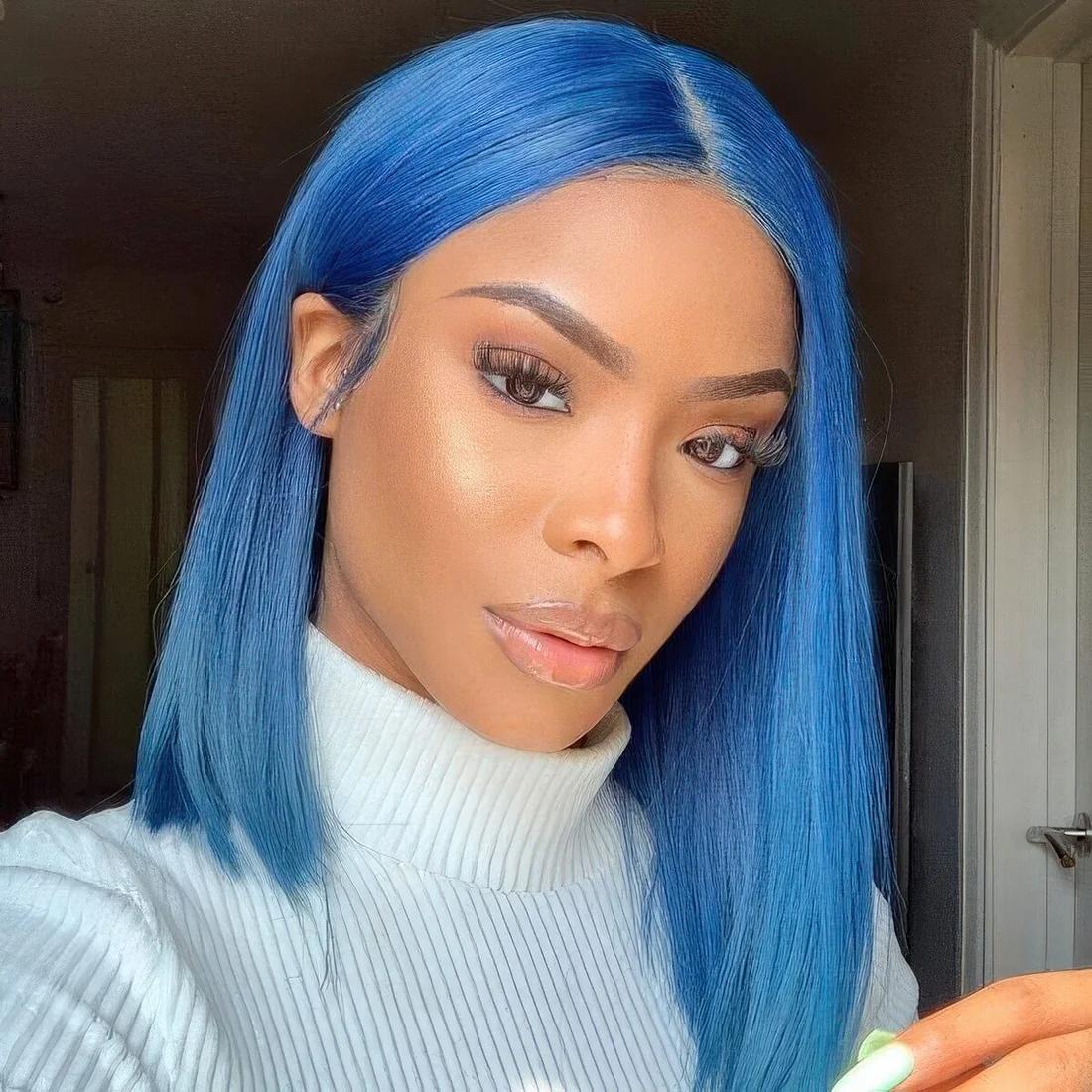 Electric blue long bob with center part and straight hair.