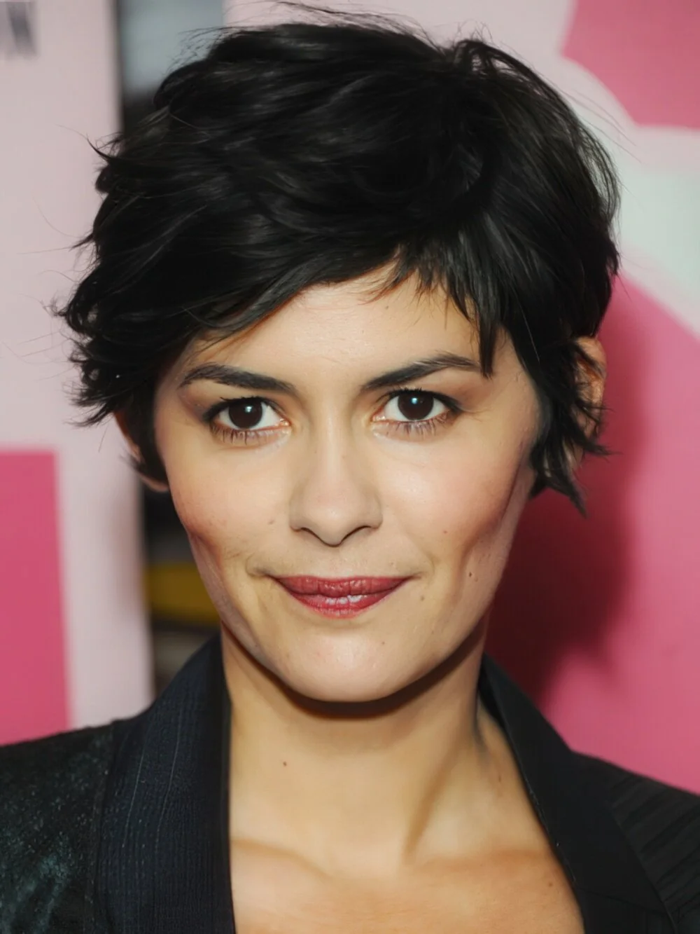 Tousled black pixie with piecey fringe.