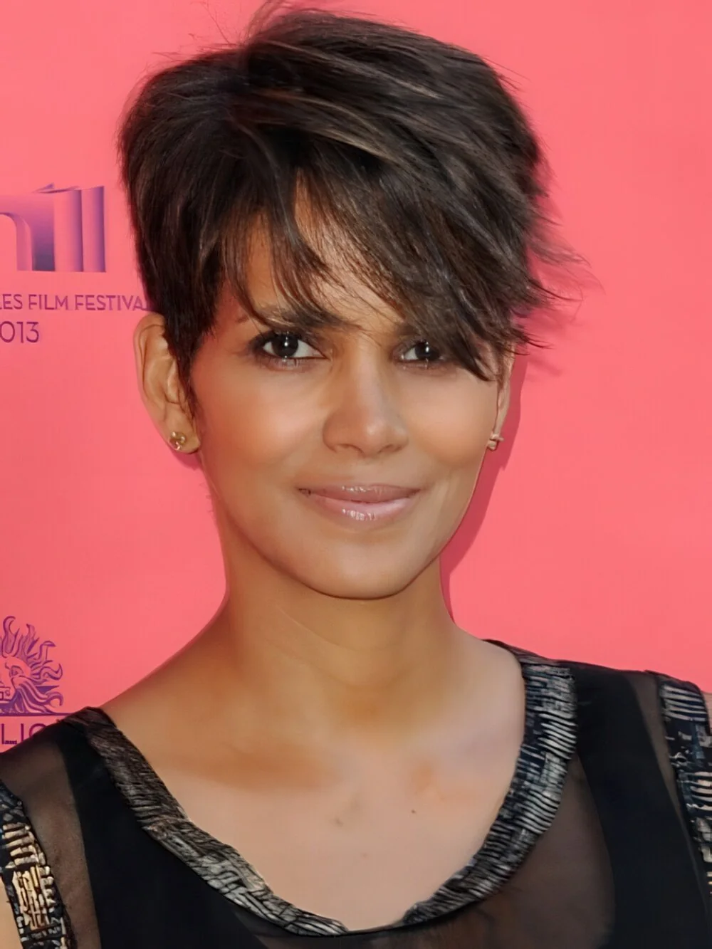 Piecey brunette pixie with side-swept bangs.