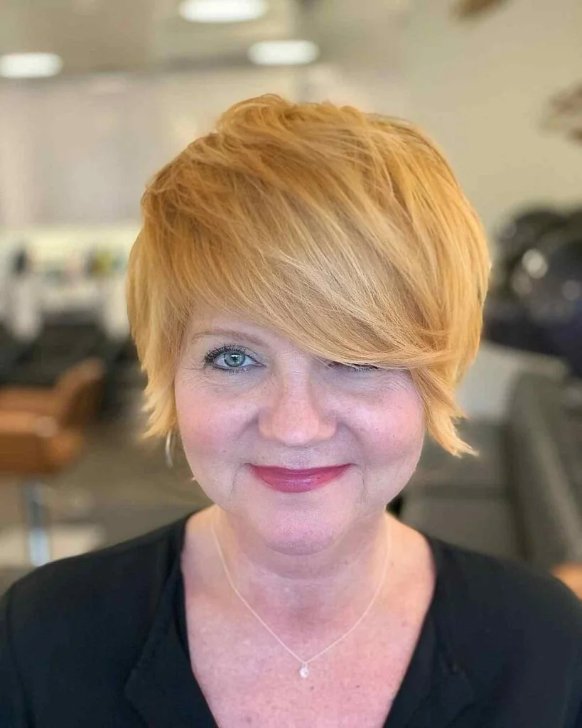 Soft golden pixie with long side bangs.