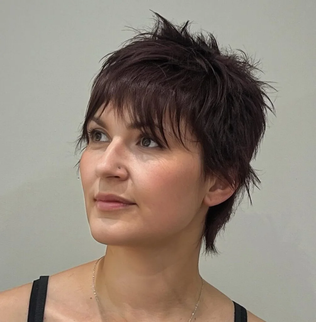 Textured dark pixie with piecey fringe.