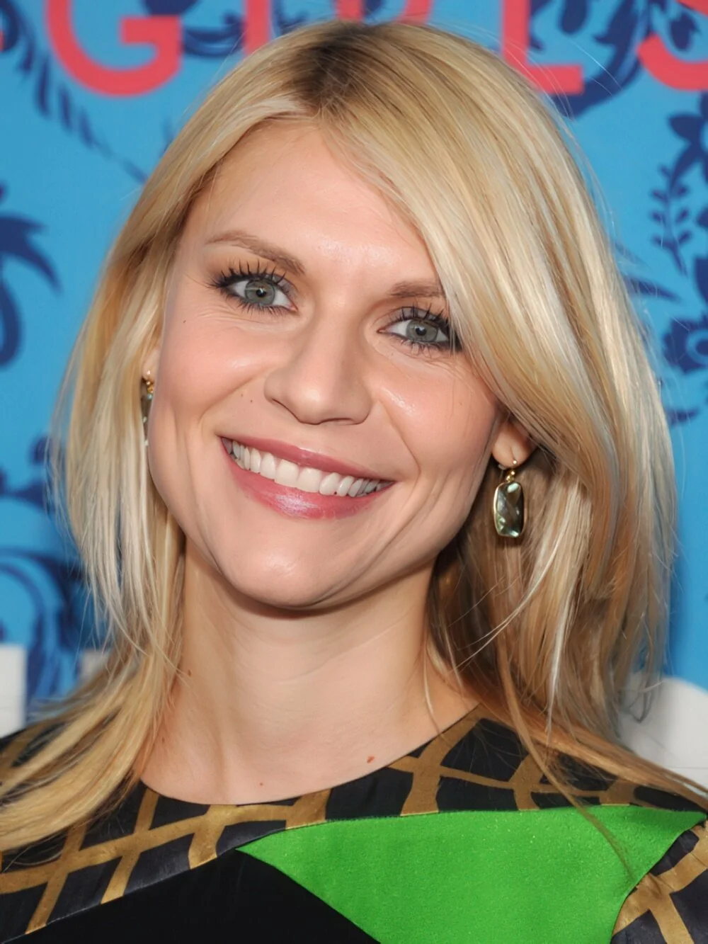 Long straight blonde layers with a side part.