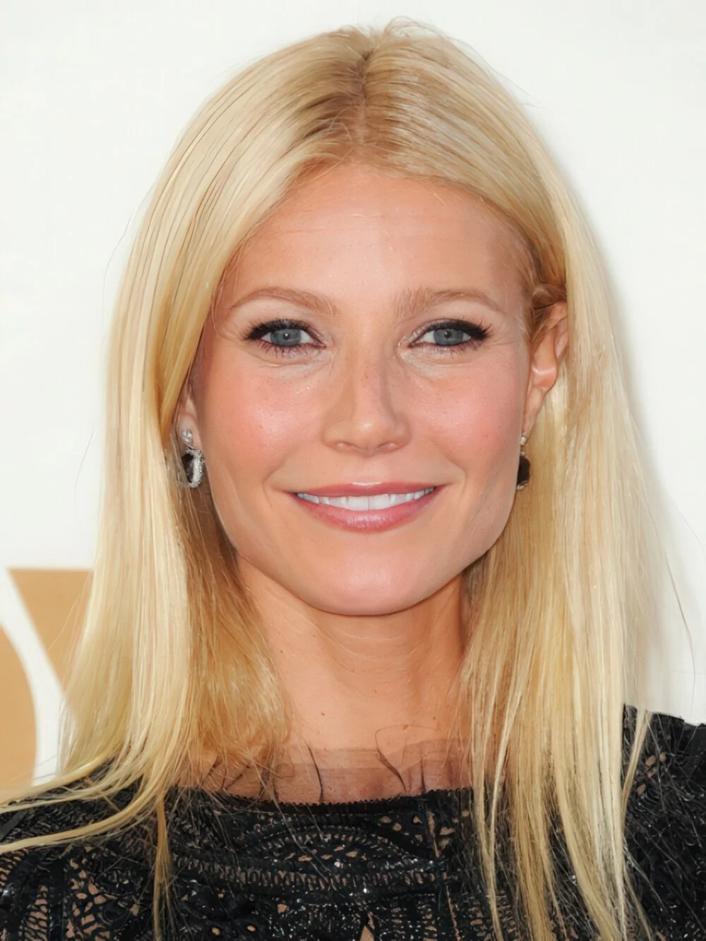Long straight blonde hair with a center part.