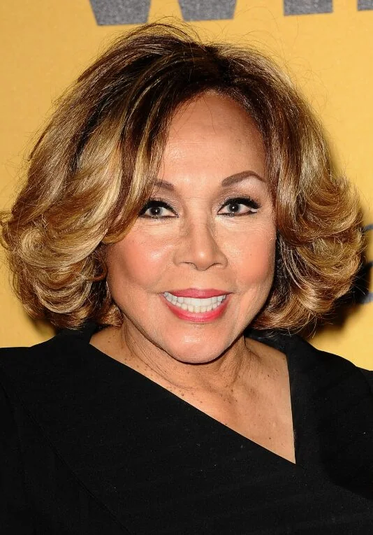 Voluminous layered bob with outward movement.