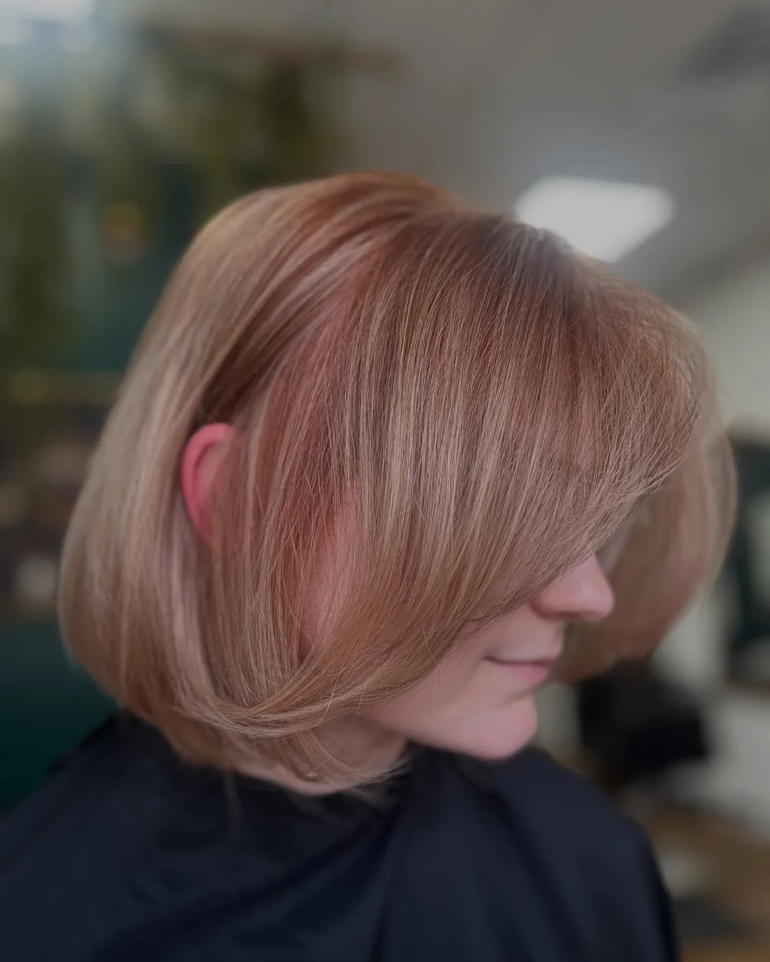 Rounded copper bob with a deep side sweep.