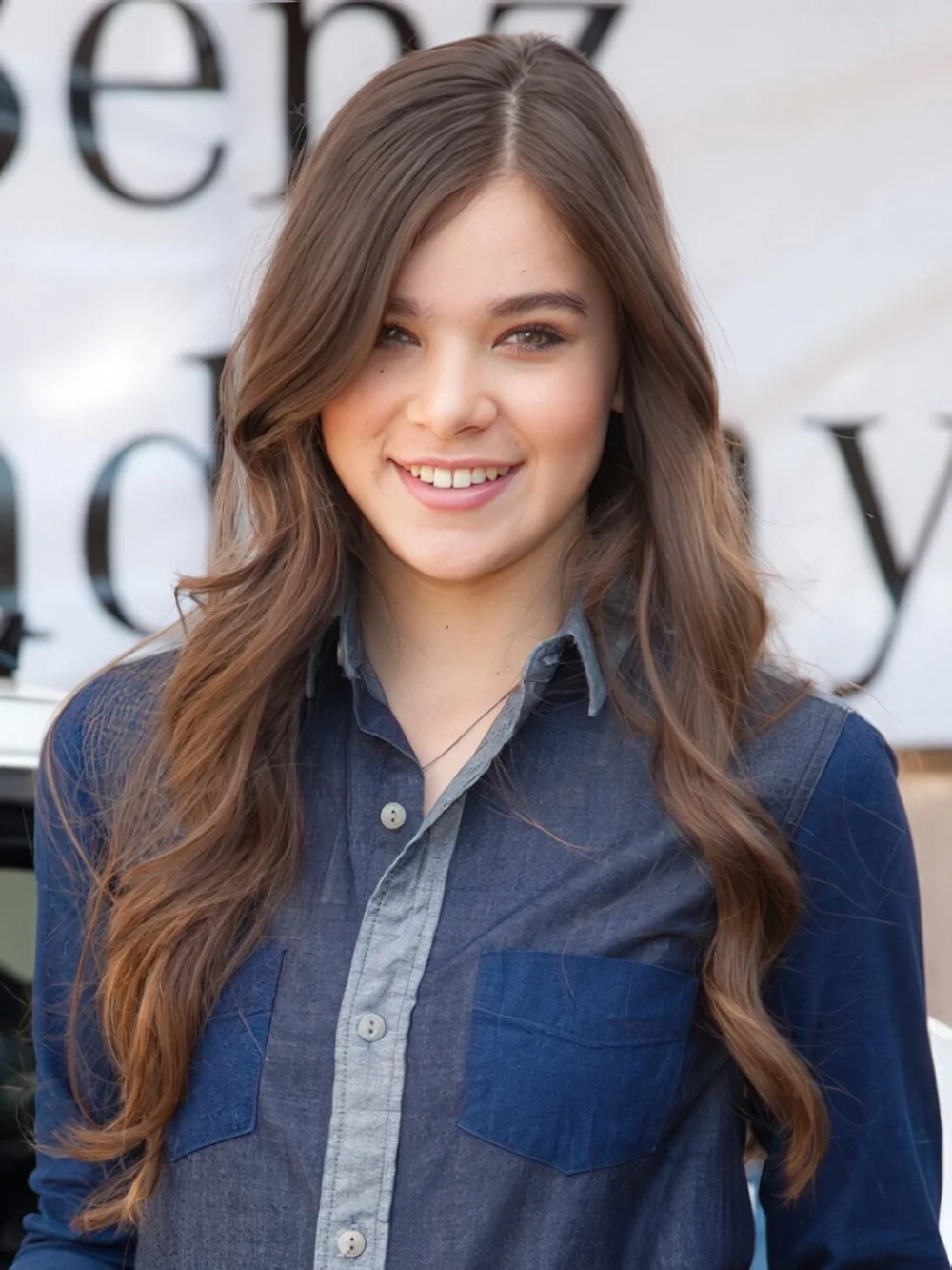 Long brunette layers with loose waves.