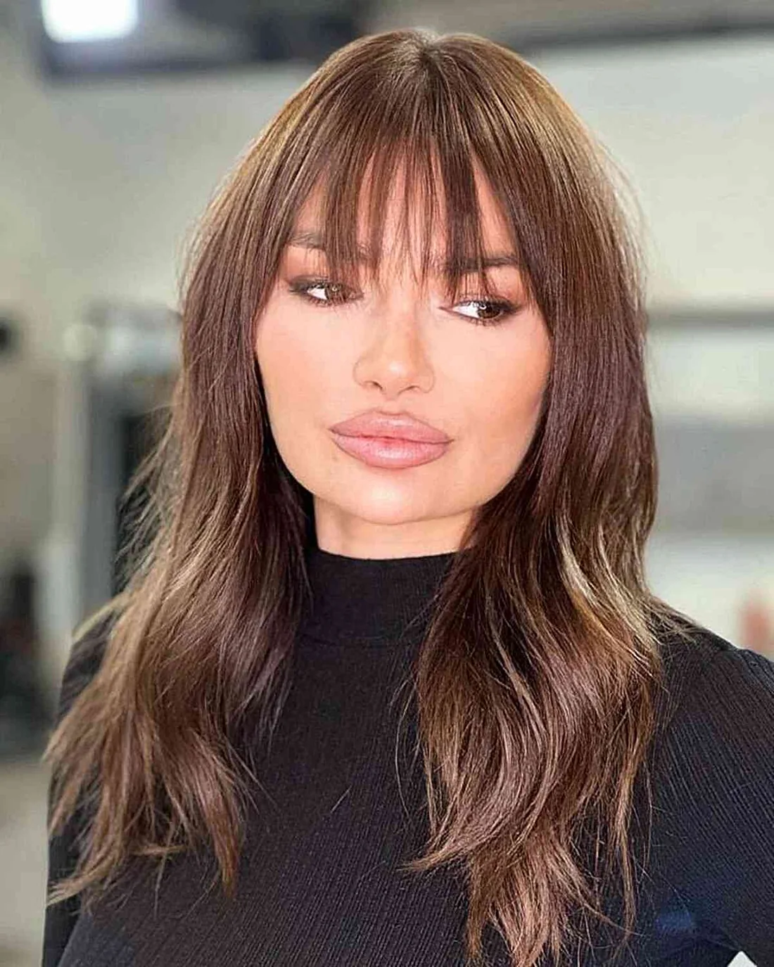 Long Layered Hair With Wispy Bangs.