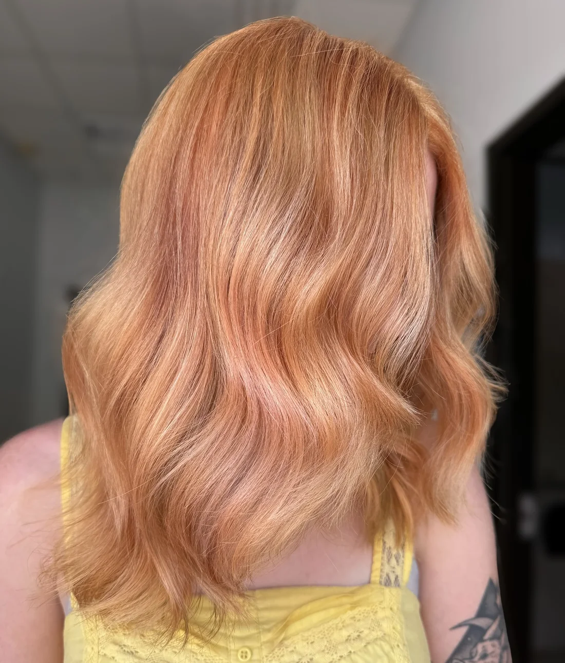 Photo showing peach Blonde Face-Framing Layers, with the hairstyle clearly visible.