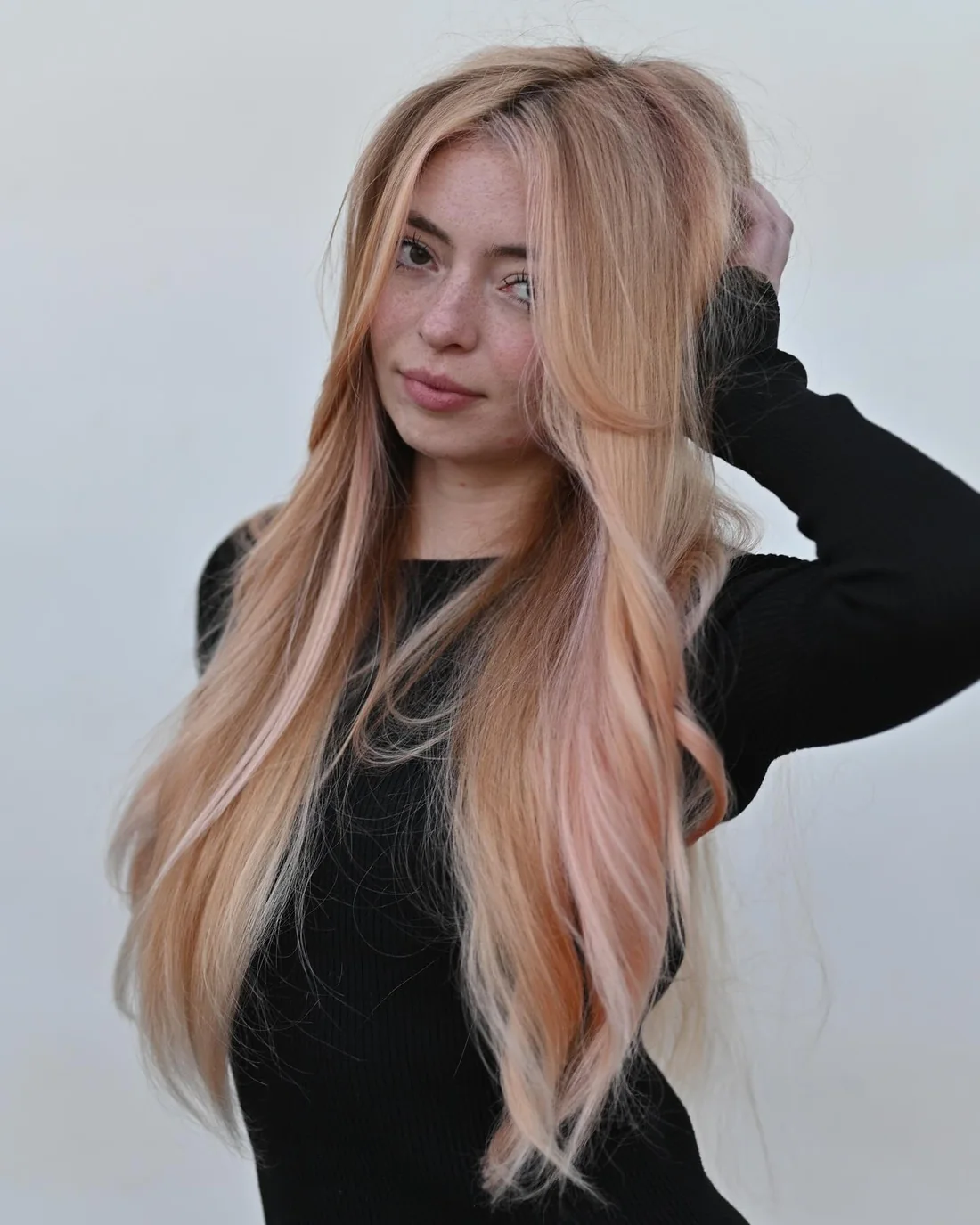 Photo showing extra-Long Peach Blonde Layers, with the hairstyle clearly visible.