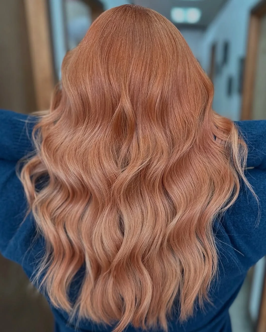 Photo showing long Rose-Gold Waves, with the hairstyle clearly visible.