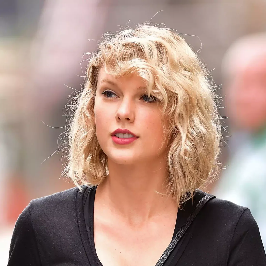 Tousled blonde bob with soft side volume.