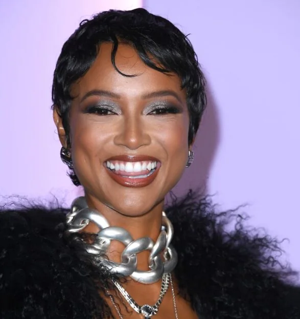 Photo showing sleek Sculpted Black Pixie, with the hairstyle clearly visible.