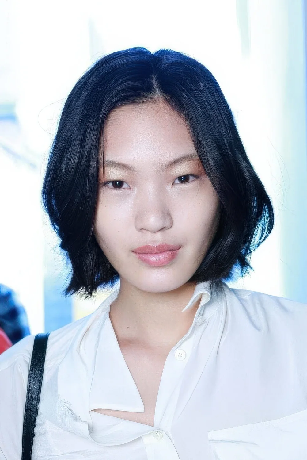 Black chin-length bob with feathered ends.