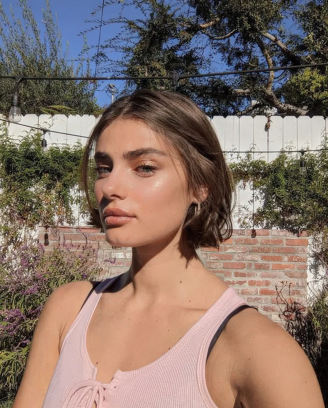 Chin-length bob with center part and a bit of mess.