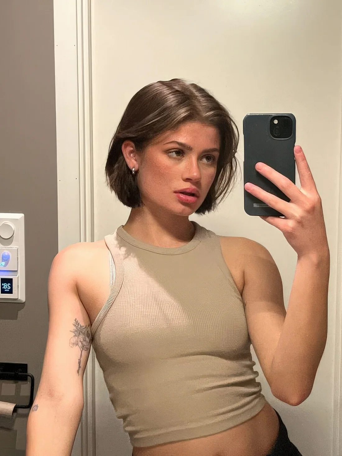 Brown volumetric chin-length cut with center part.