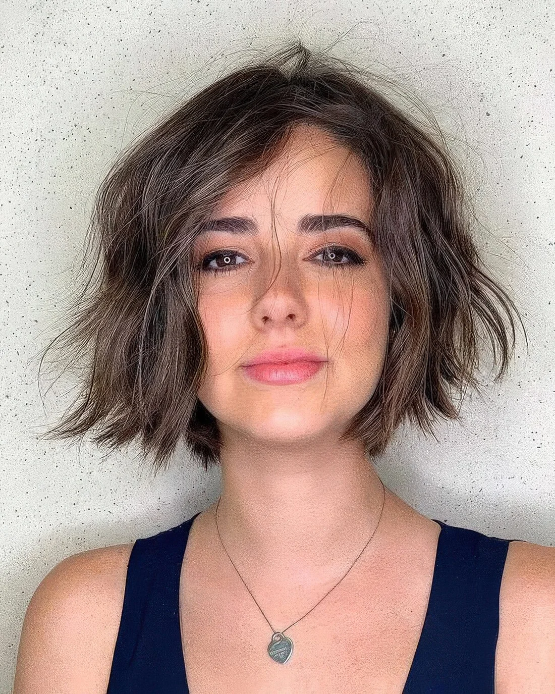 Messy and textured 90s bob with some volume and waves.